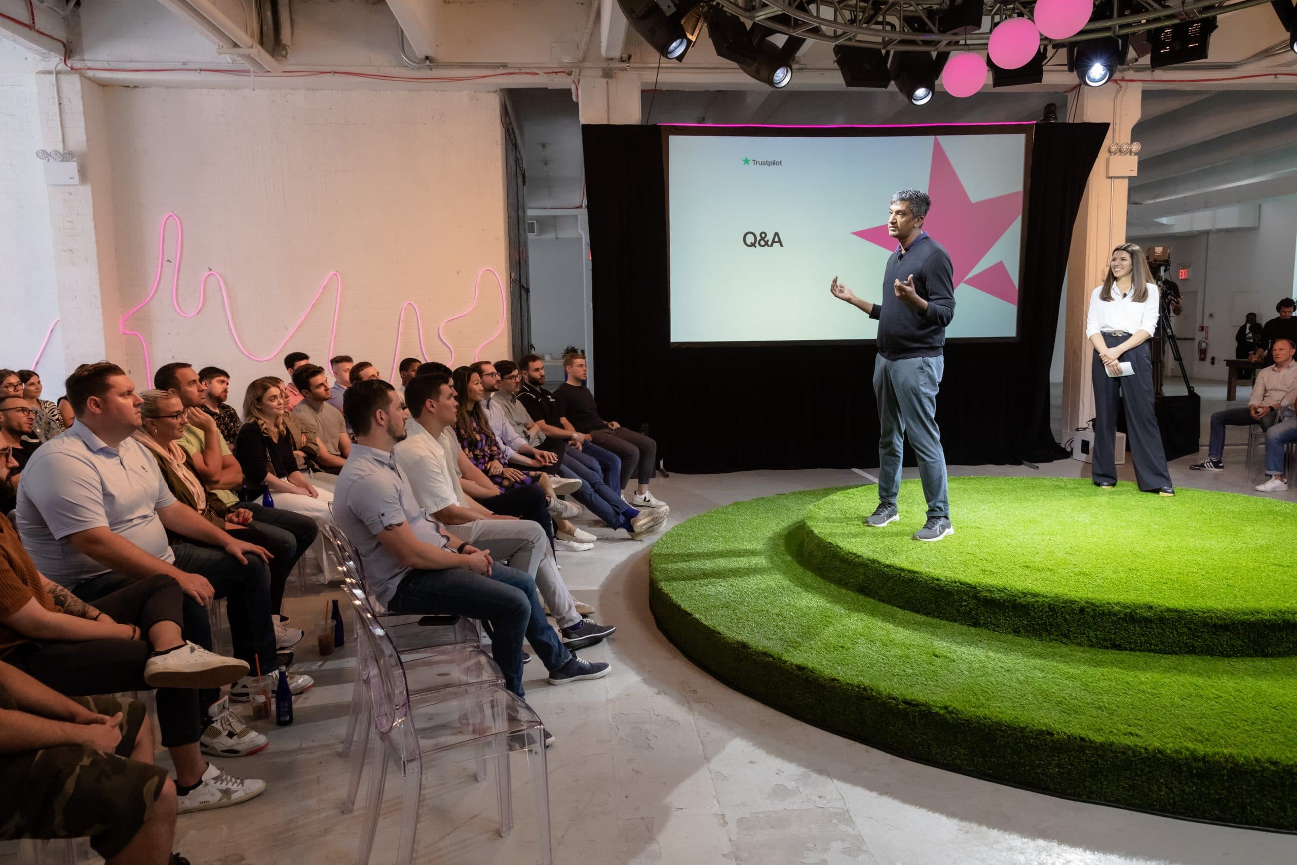 2_KPI_4 Man presents on stage at Trust Pilot event